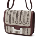 HERMèS Limited Edition Constance Toile de Camp 24 Dechainee shoulder bag in Canvas and Bordeaux Swift leather with Palladium hardware