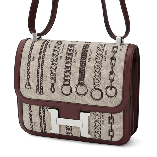 HERMèS Limited Edition Constance Toile de Camp 24 Dechainee shoulder bag in Canvas and Bordeaux Swift leather with Palladium hardware