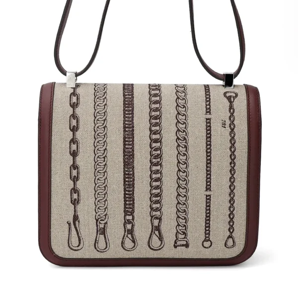 HERMèS Limited Edition Constance Toile de Camp 24 Dechainee shoulder bag in Canvas and Bordeaux Swift leather with Palladium hardware