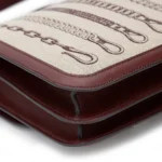 HERMèS Limited Edition Constance Toile de Camp 24 Dechainee shoulder bag in Canvas and Bordeaux Swift leather with Palladium hardware