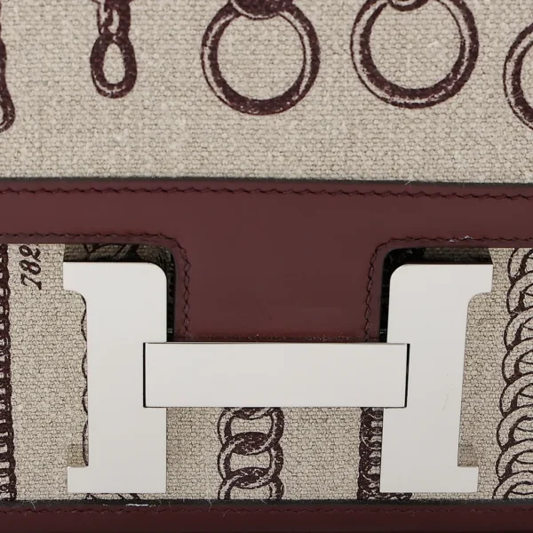 HERMèS Limited Edition Constance Toile de Camp 24 Dechainee shoulder bag in Canvas and Bordeaux Swift leather with Palladium hardware