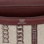HERMèS Limited Edition Constance Toile de Camp 24 Dechainee shoulder bag in Canvas and Bordeaux Swift leather with Palladium hardware