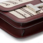 HERMèS Limited Edition Constance Toile de Camp 24 Dechainee shoulder bag in Canvas and Bordeaux Swift leather with Palladium hardware