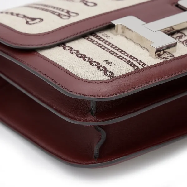 HERMèS Limited Edition Constance Toile de Camp 24 Dechainee shoulder bag in Canvas and Bordeaux Swift leather with Palladium hardware