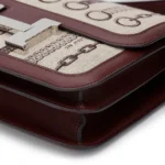 HERMèS Limited Edition Constance Toile de Camp 24 Dechainee shoulder bag in Canvas and Bordeaux Swift leather with Palladium hardware